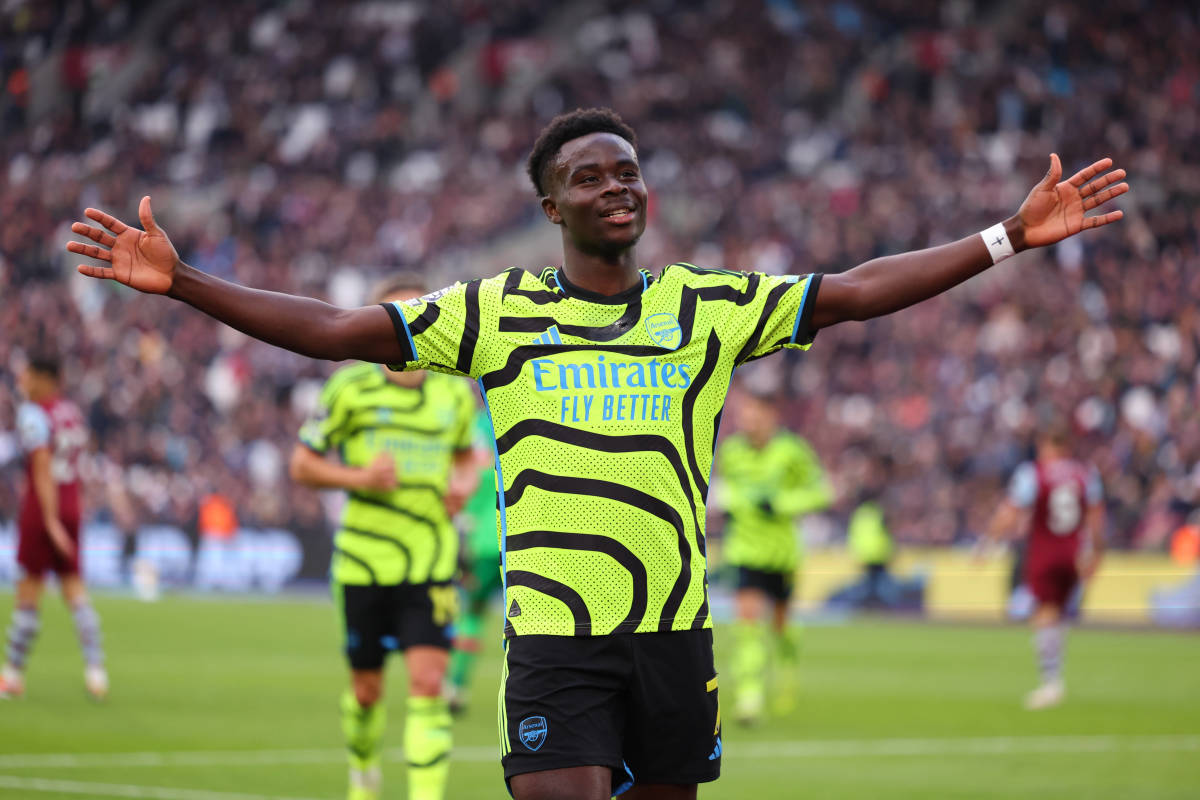 Bukayo Saka pictured celebrating after scoring two goals for Arsenal in a 6-0 win at West Ham in February 2024